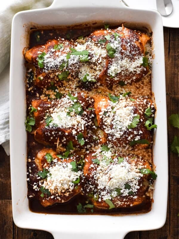 Make your life a little tastier with these cheesy Chicken Enchilada Roll Ups covered in an authentic red enchilada sauce. Plus, they're low carb and gluten free!