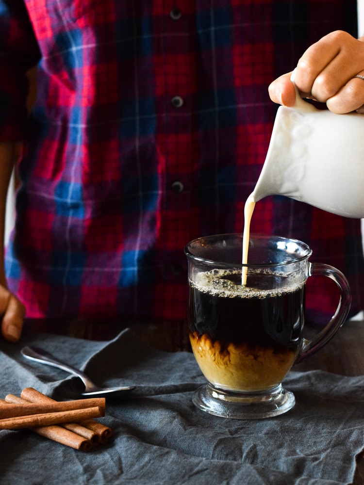 This Mexican Tres Leches Coffee topped with a mountain of whipped cream, cinnamon and chocolate shavings is easy to make at home and irresistibly yummy! Perfect for the holidays and the cold winter nights!