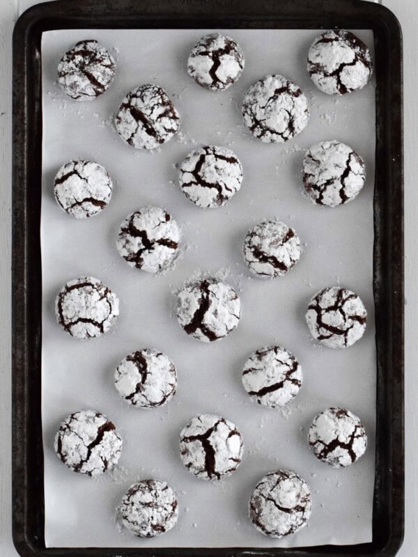 Classic holiday Chocolate Crinkle Cookies with a twist! Made with Abuelita Mexican chocolate, these festive cookies are soft, chewy and covered in powdered sugar.