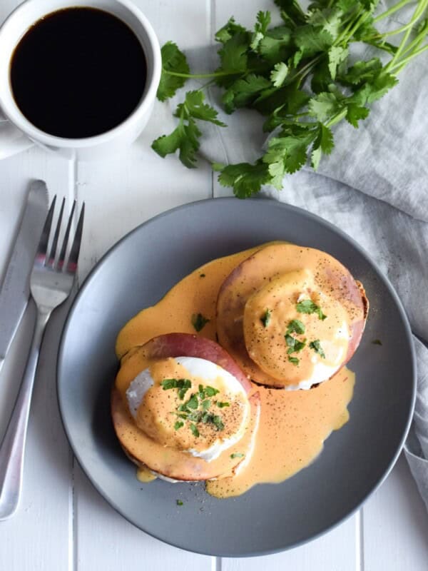 Easy Chipotle Eggs Benedict recipe made with a lightened-up blender chipotle hollandaise sauce. Ready in only 25 minutes and is the perfect brunch!