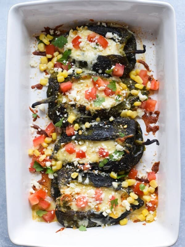 Baked Vegetarian Chile Rellenos - a healthier version of the traditional Mexican dish, these stuffed poblanos are baked and filled with veggies and cheese! (gluten free, low carb)