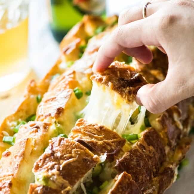 Cheesy, spicy and fun to eat, this Jalapeno Popper Pull Apart Bread is the perfect game day appetizer that's easy to make and ready in 35 minutes!