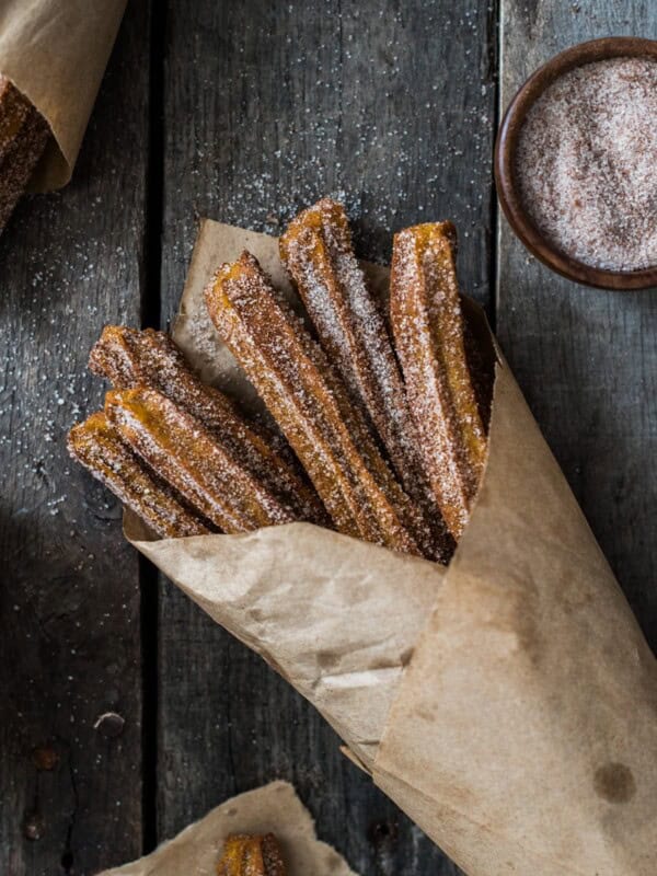 Baked Pumpkin Churros covered in cinnamon sugar are the perfect fall and winter dessert. They're baked, not fried, which means you can eat more of them!