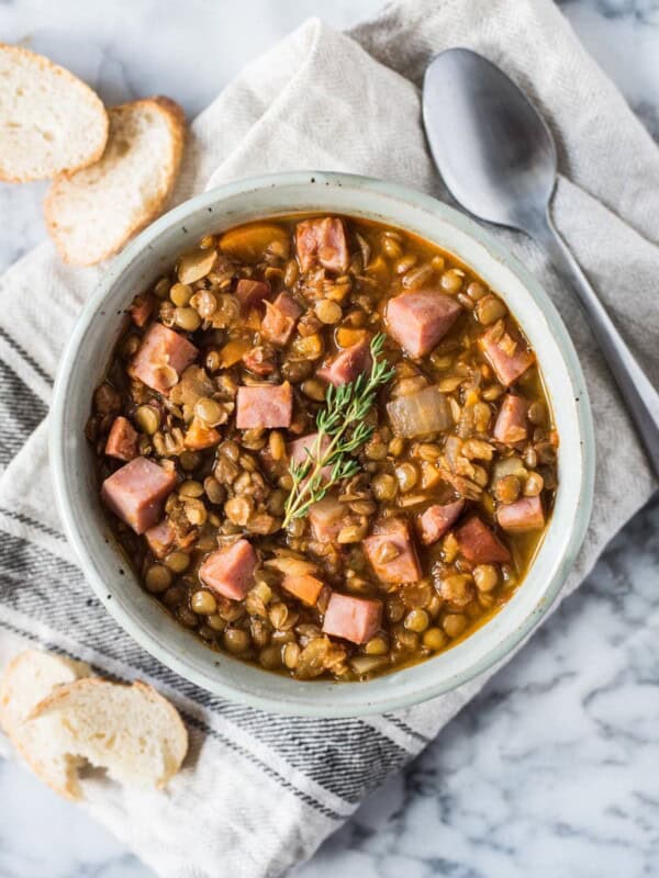 This Spicy Lentil Soup makes for a simple and hearty dinner. Full of healthy ingredients, it's an easy recipe that will keep you full and warm all season long (freezer friendly, gluten free) #mealprep #lentils #leftoverham #lentilsoup #spicysoup