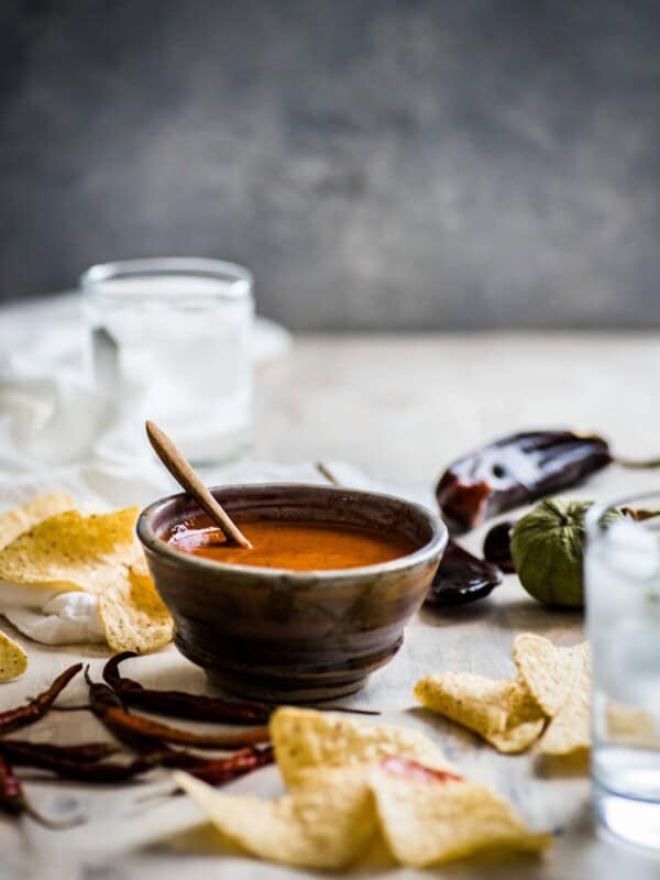 This Toasted Red Chile Salsa made with dried Arbol and New Mexico chiles, tomatillos and garlic is easy to make and perfectly spicy. Add to eggs, tacos and more!