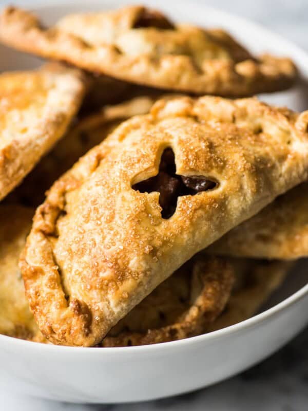 Baked Apple Empanadas are the perfect dessert for the fall and winter seasons! They're portable, delicious and super addicting.