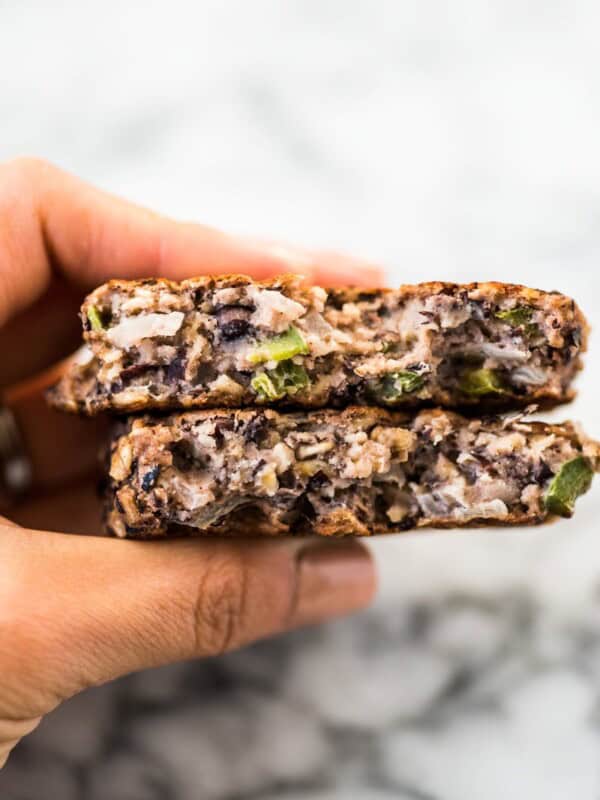 These Black Bean Patties are crispy on the outside, creamy on the inside and served with a cilantro yogurt sauce. Makes tasty black bean burgers! #vegetarian #blackbeanburger #veggieburger #blackbeans