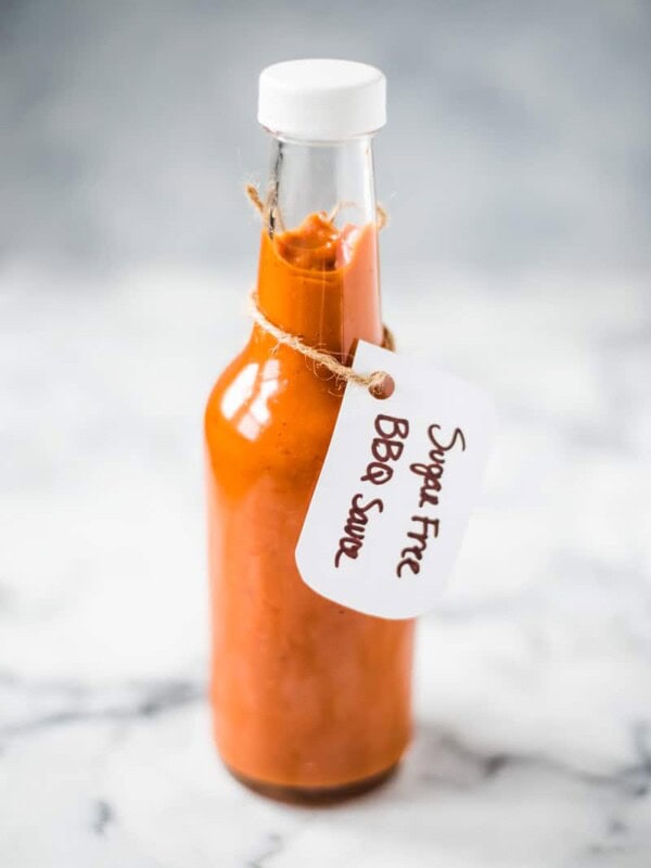 This homemade Sugar Free BBQ Sauce is made with chipotle peppers, caramelized onions and a blend of spices that's healthy, wholesome and insanely addicting! It's gluten free, dairy free, paleo, vegetarian and vegan. #bbqsauce #barbecue #sugarfree #bbq