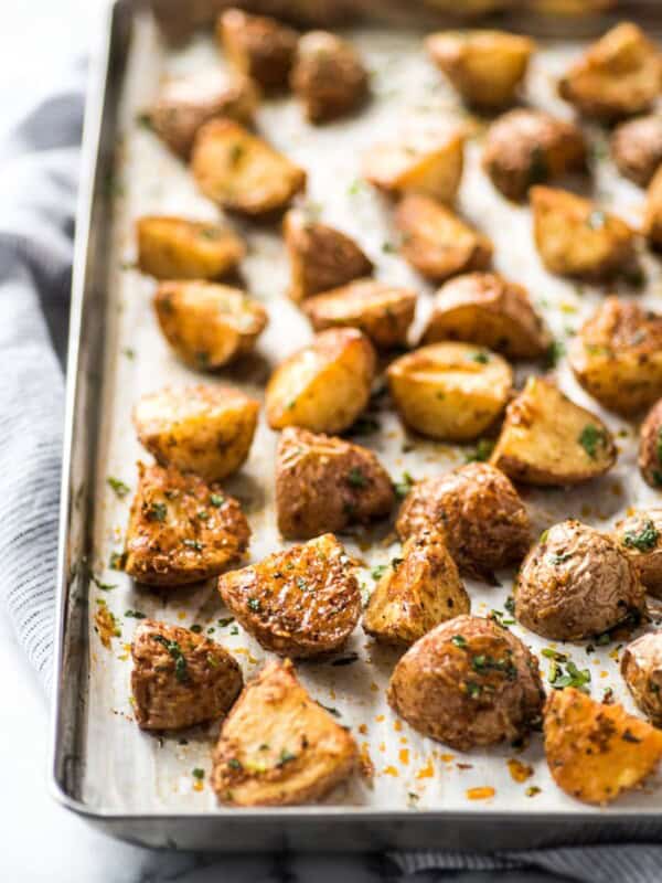 These Mexican Crispy Roasted Potatoes seasoned with chili powder, garlic, sea salt and Parmesan cheese are baked, not fried and are the perfect side to weekday meals. (gluten free, vegetarian)