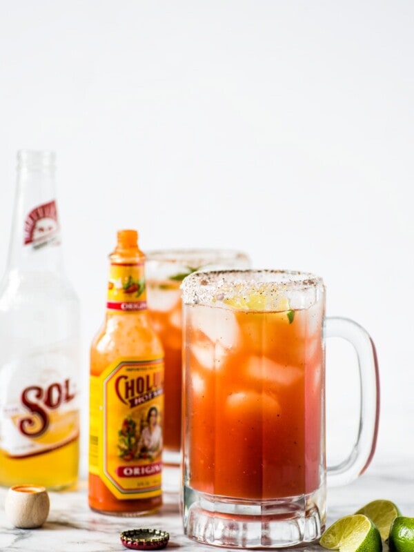 This refreshing Michelada recipe made with Clamato juice and Mexican beer is the perfect cocktail for brunch or alongside your favorite Mexican party foods!