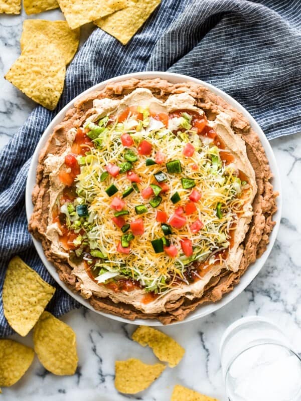 This Healthy Taco Dip made with 5 layers of delicious ingredients is ready in under 10 minutes and is the perfect appetizer for any party!