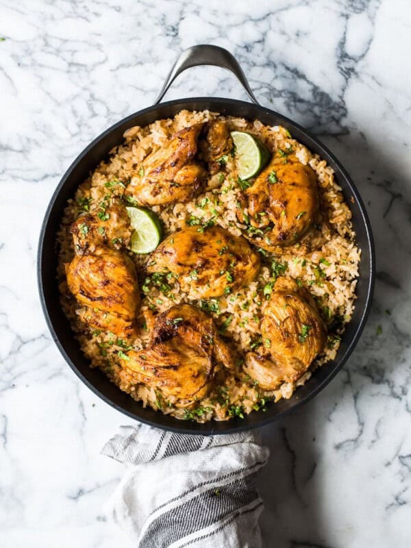 This Mexican Chicken and Rice features tender, juicy marinated chicken thighs and authentic Mexican rice cooked all in one pot!