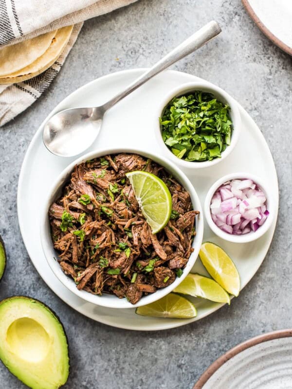 This moist and tender Mexican Shredded Beef is made in the Instant Pot in less than 2 hours! Its delicious by itself or great in tacos, salads and more.