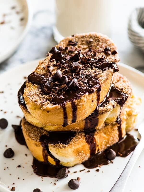 This Cinnamon French Toast is covered in cinnamon sugar and topped with a Mexican chocolate sauce. All the flavor of Mexican churros - but for breakfast!﻿