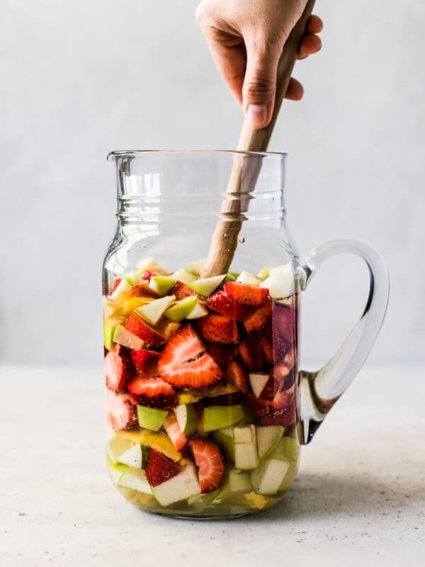 White sangria in a glass pitcher.