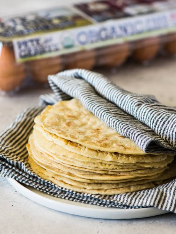 Paleo Tortillas wrapped in a clean kitchen towel.