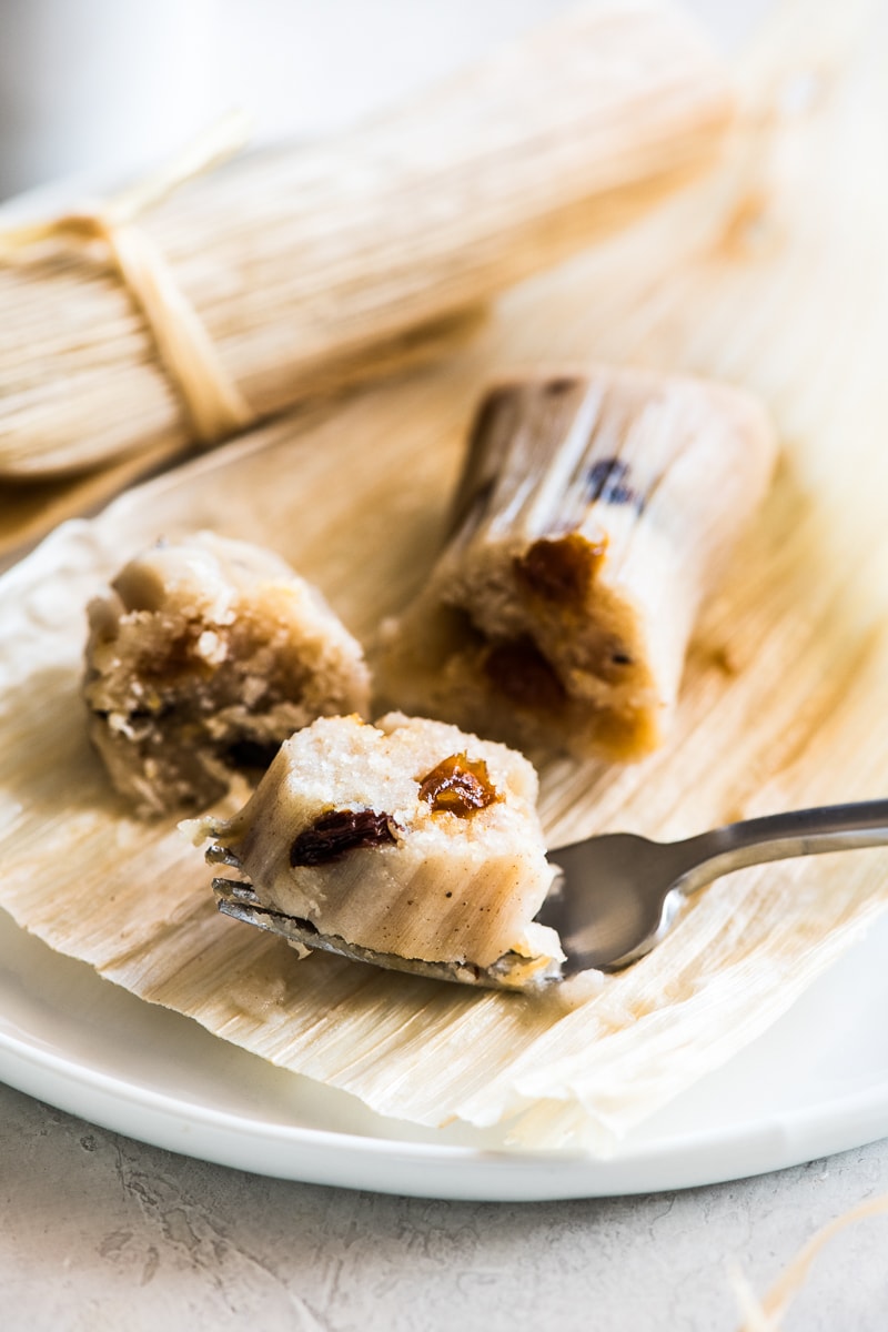 A slice of sweet raisin tamales on a fork.