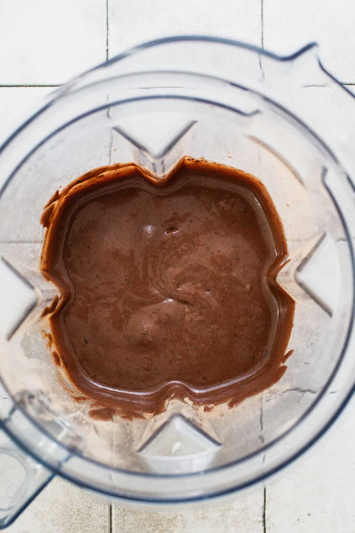 Blended batter for black bean brownies in a blender.