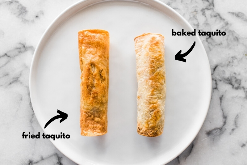 A fried taquito and a baked taquito side by side on a plate