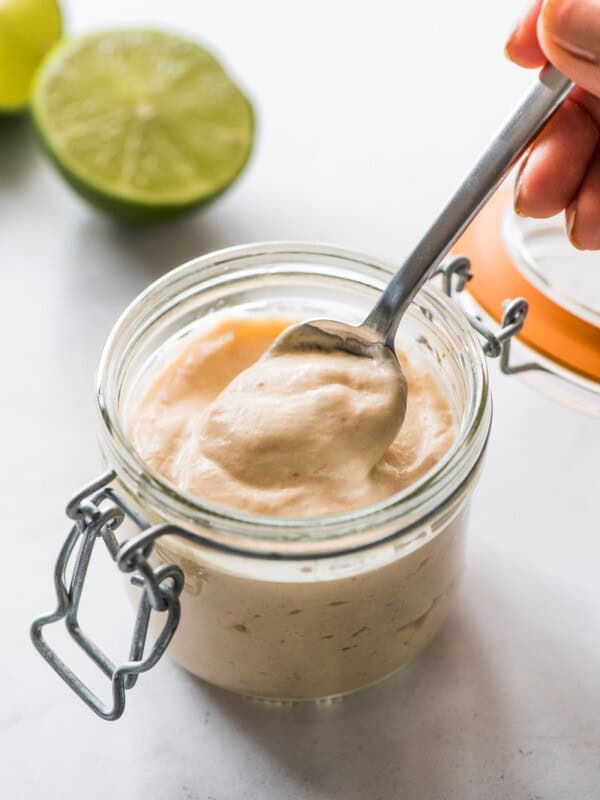 Fish taco sauce in a jar with a spoon