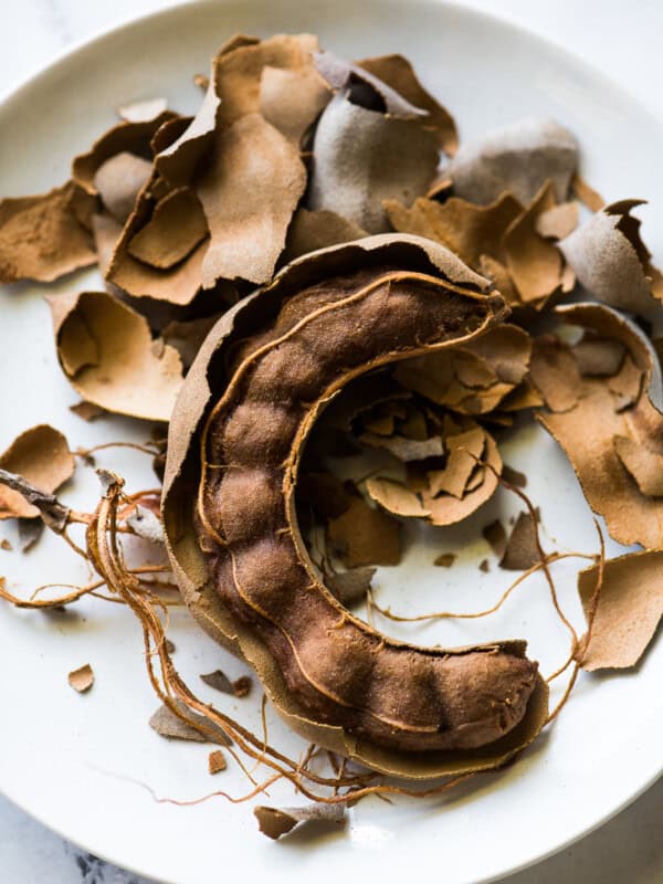 An open tamarind pod for agua de tamarindo.