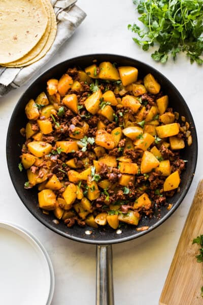 Papas con Chorizo (Potatoes with Chorizo) - Isabel Eats