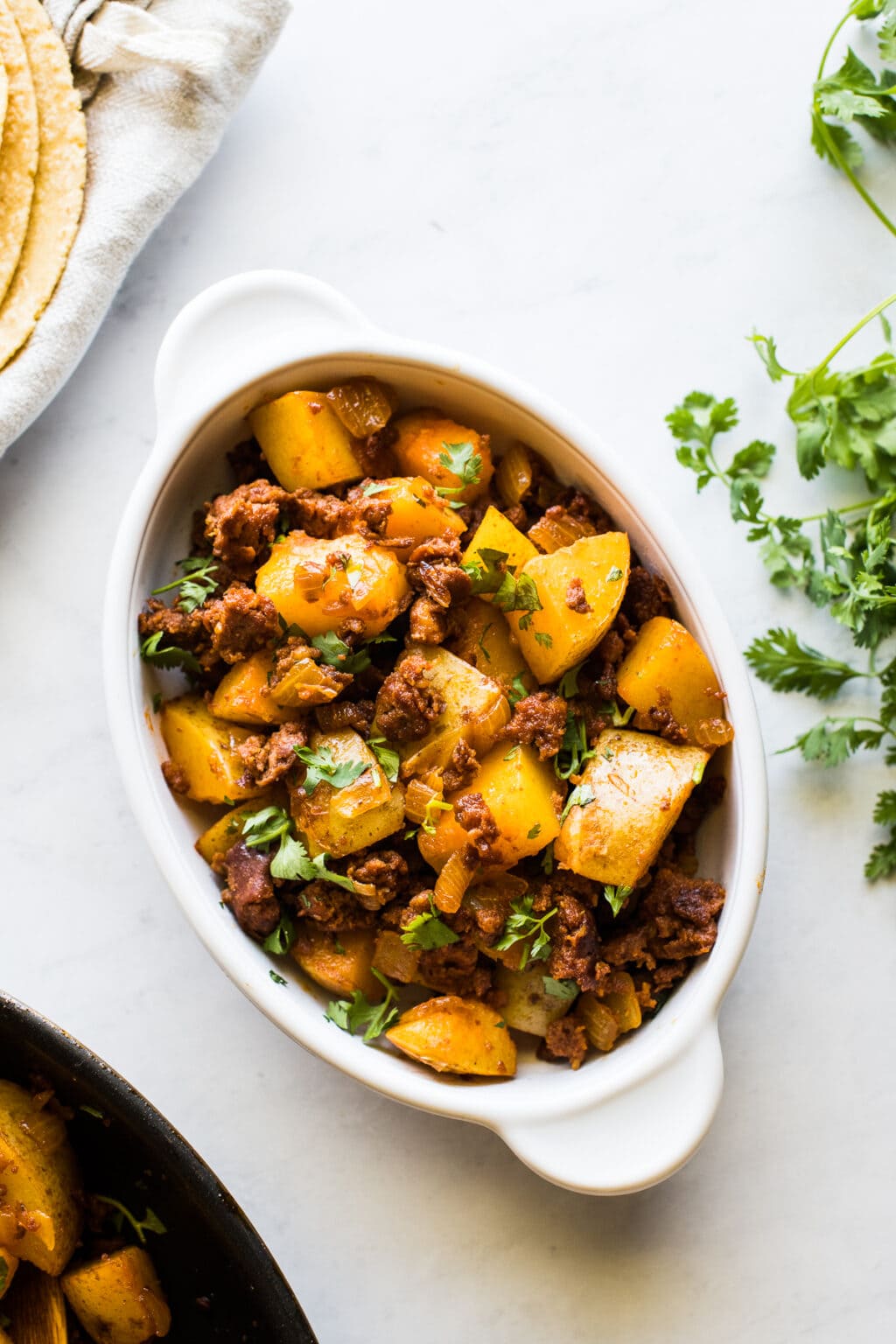 Papas con Chorizo (Potatoes with Chorizo) - Isabel Eats