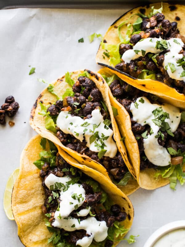 Black Bean Tacos topped with crema and chopped cilantro.