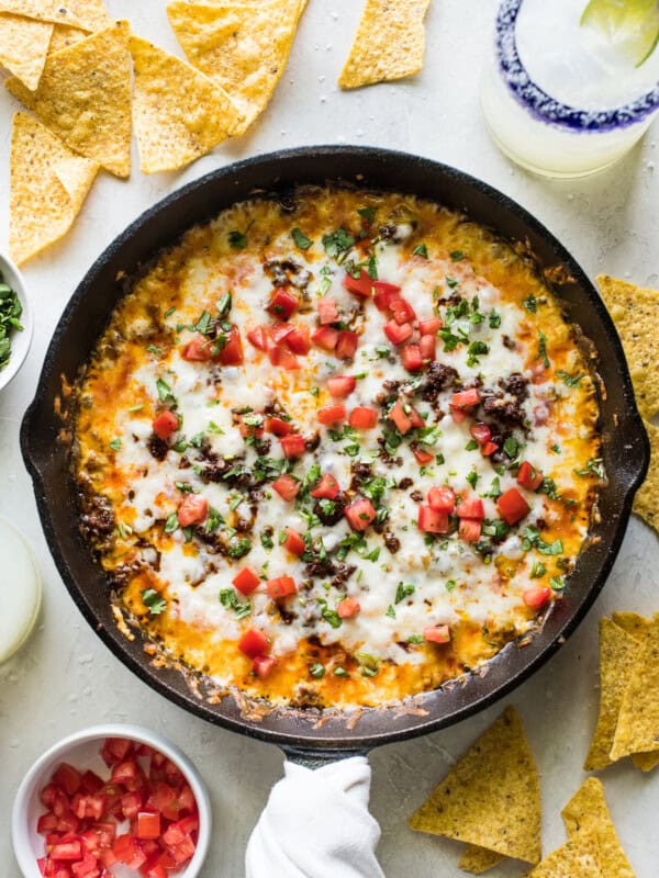 Queso fundido in a skillet with crumbled chorizo.