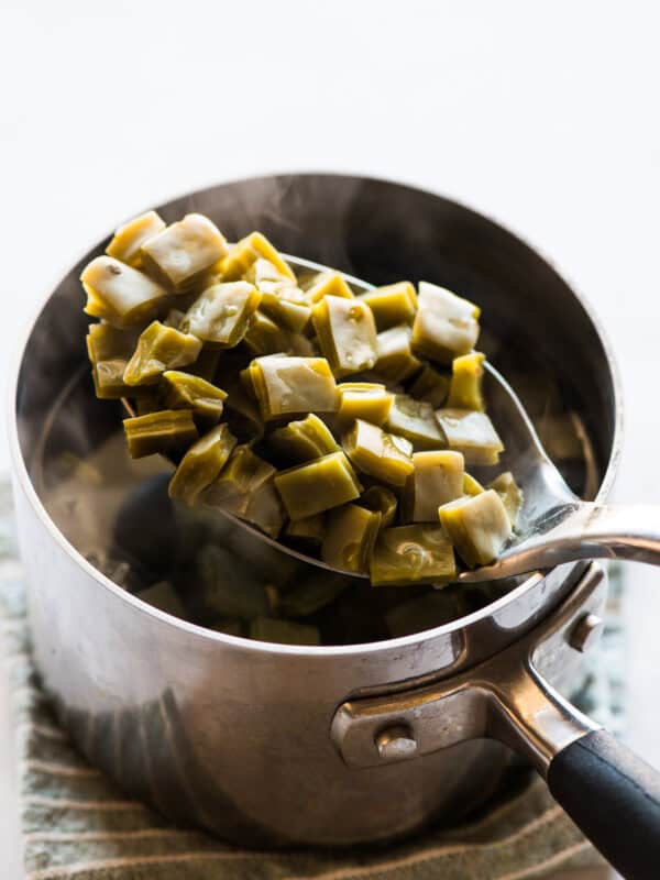 Cooked nopales on a spoon.