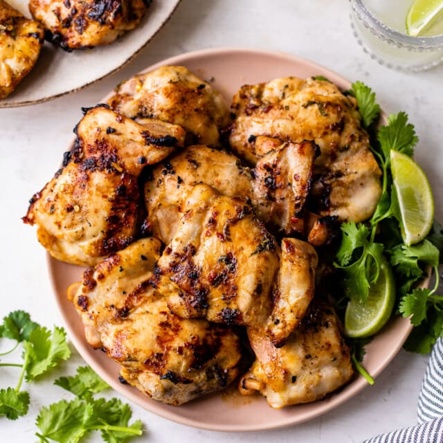 Lime chicken marinated thighs on a plate ready to eat.