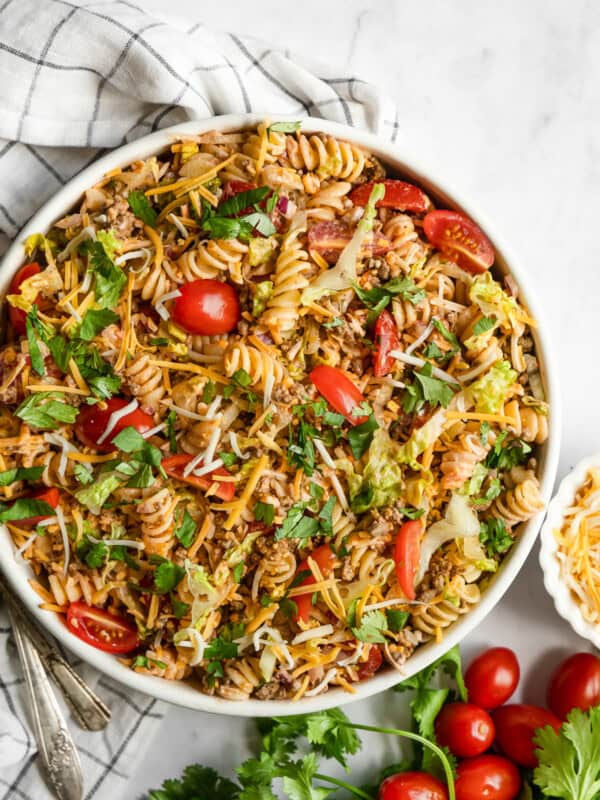 Taco pasta salad in a bowl topped with cilantro.