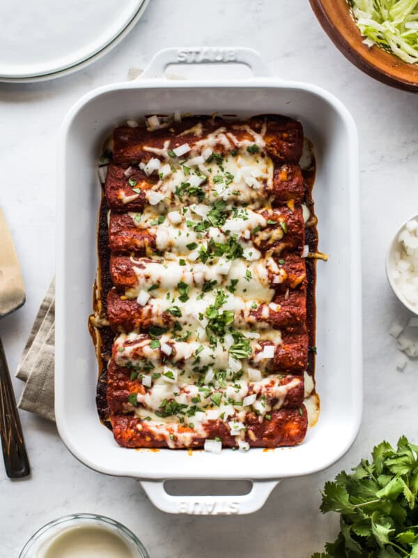 Cheese enchiladas in a baking dish.