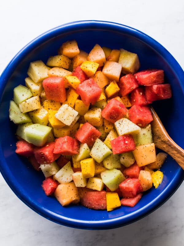 Mexican Fruit Salad topped with chili lime tajin seasoning.