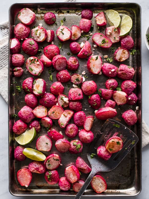 Roasted radishes on a sheet pan.