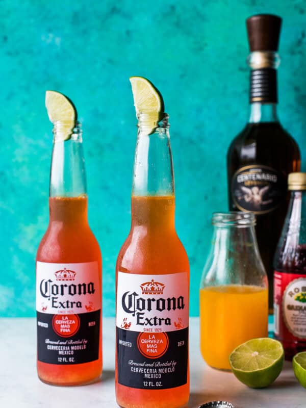 Corona sunrise drink (as seen on TikTok) with lime wedge in bottle.