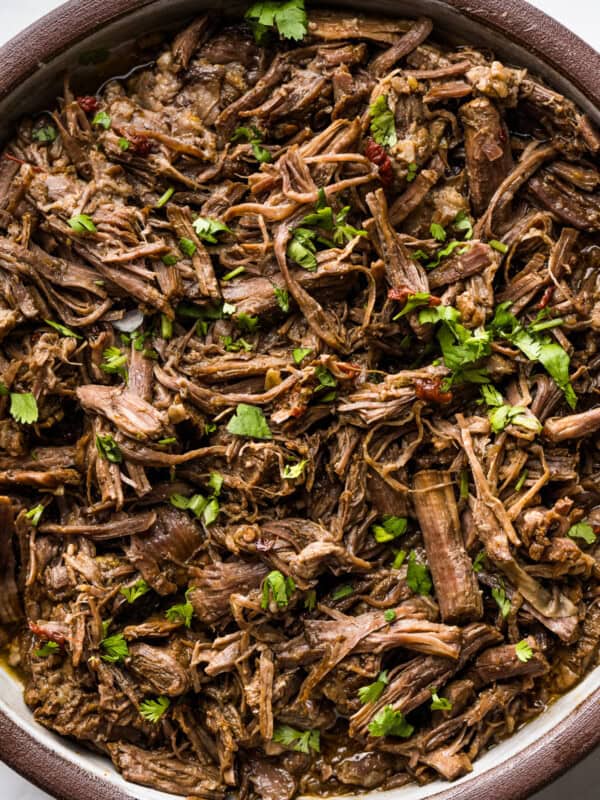 Shredded barbacoa beef in a serving bowl ready to eat.