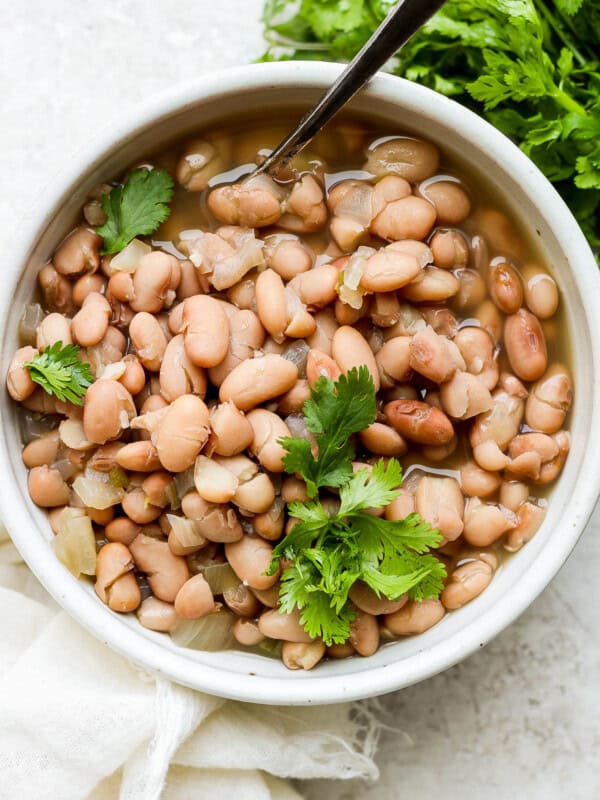 Crock pot pinto beans in a bowl.