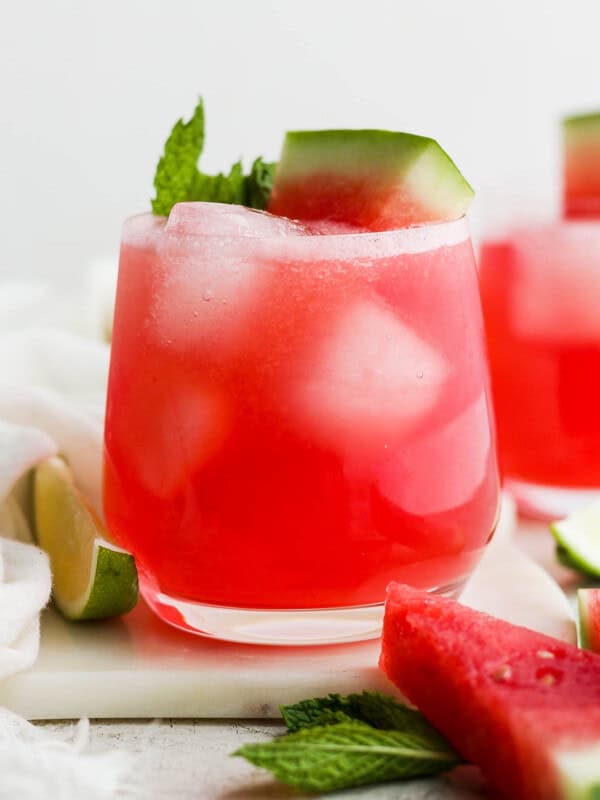 Watermelon agua fresca (agua de sandia) in a glass with ice cubes.