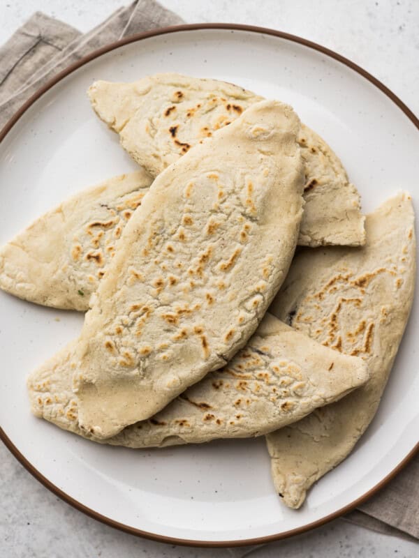 Tlacoyos filled with beans on a plate.