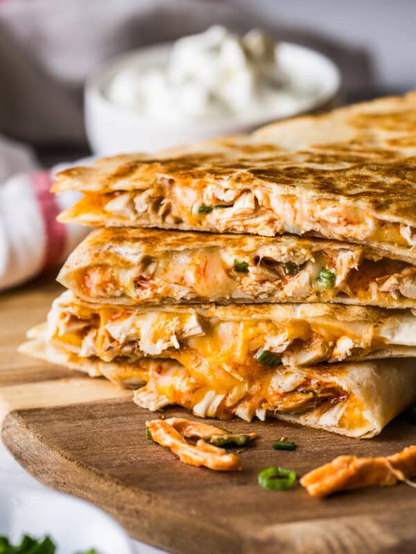 Buffalo chicken quesadillas stacked on top of one another.