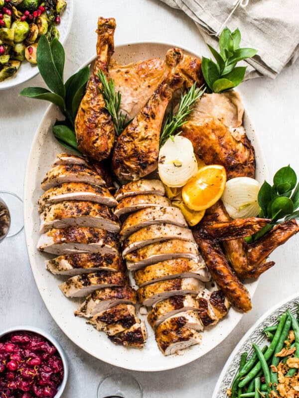 A Mexican Thanksgiving turkey carved and served on a platter ready to be eaten.