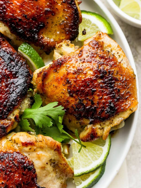 Cilantro Lime Chicken with a golden crispy skin on a plate.