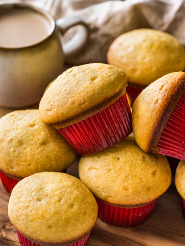 Mantecadas on a table with a red muffin cupcake liner.