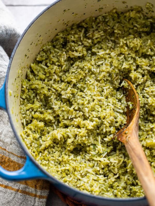 Arroz verde (Mexican green rice) in a large pot with a serving spoon.