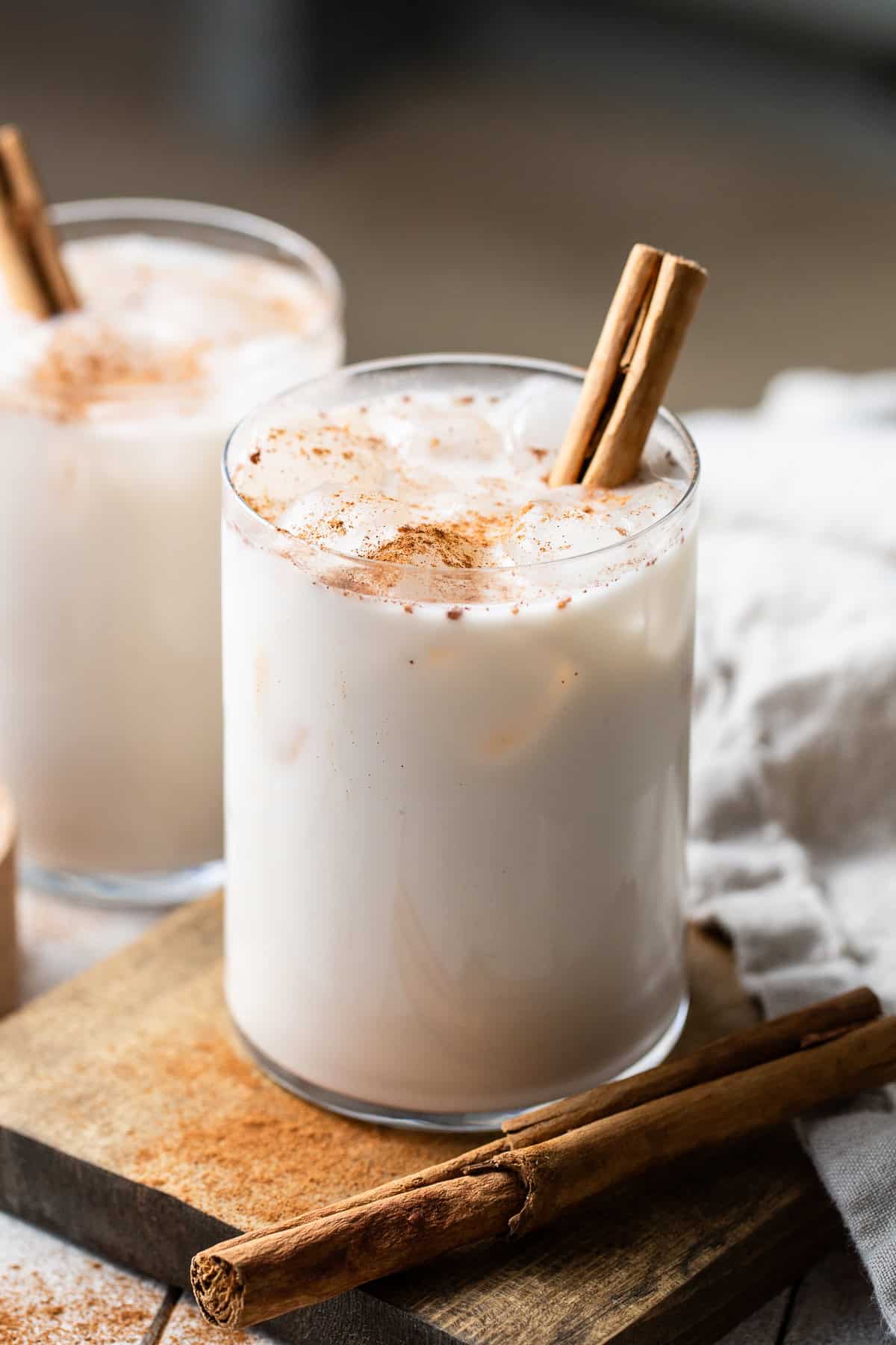 Horchata served in a tall glass with ice and cinnamon.