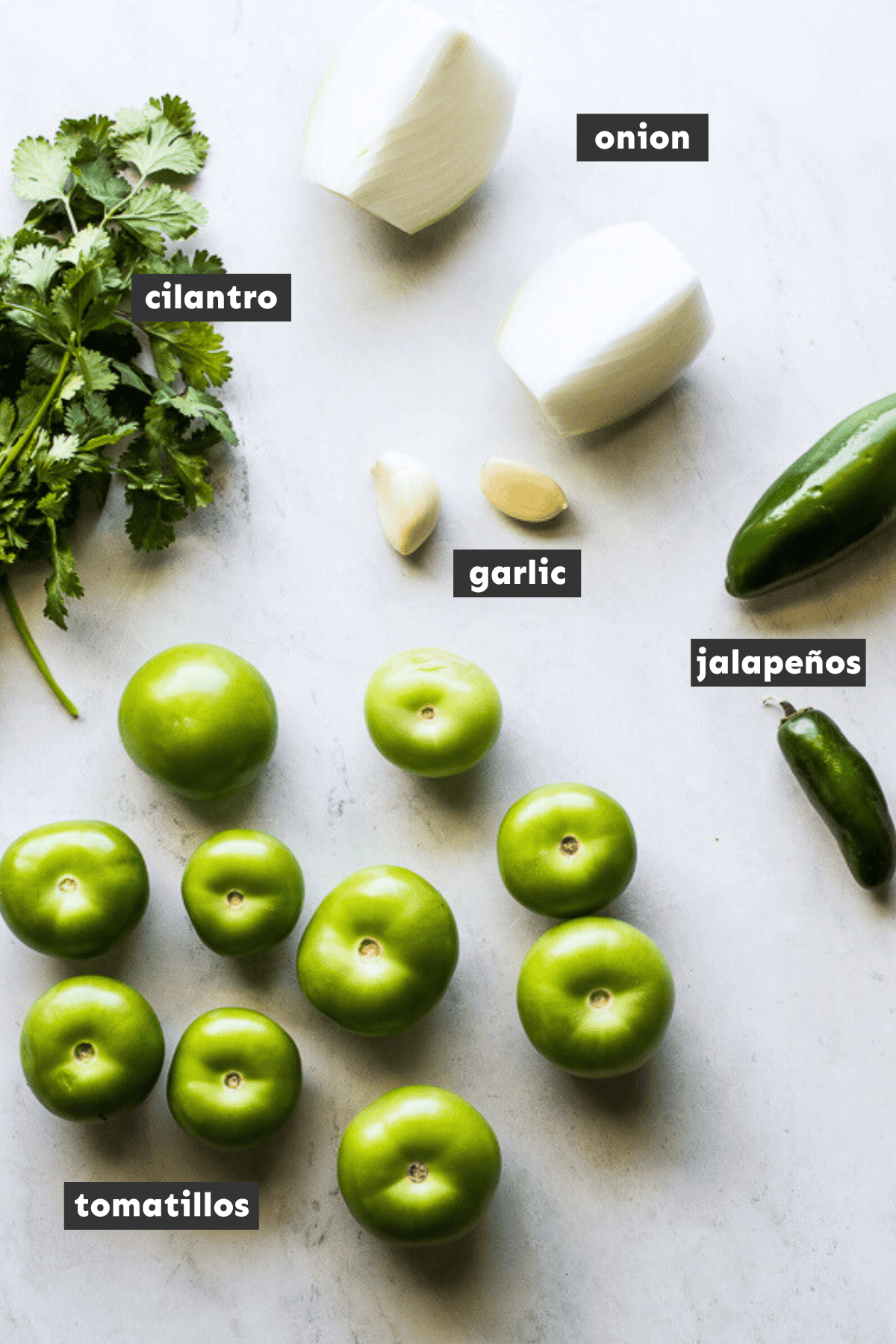 Ingredients in salsa verde on a table.