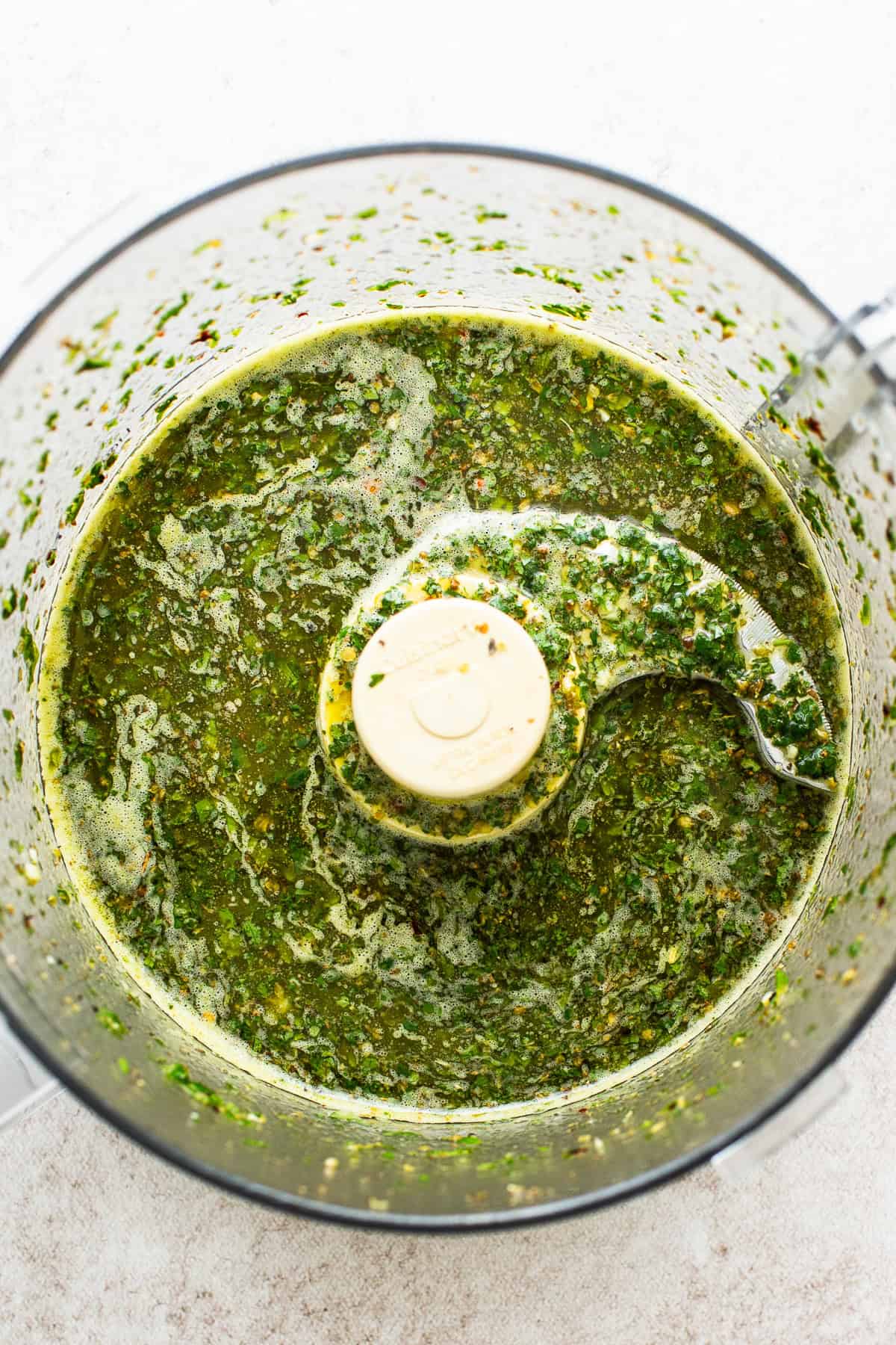 All ingredients for the chimichurri sauce added and blended in a  food processor