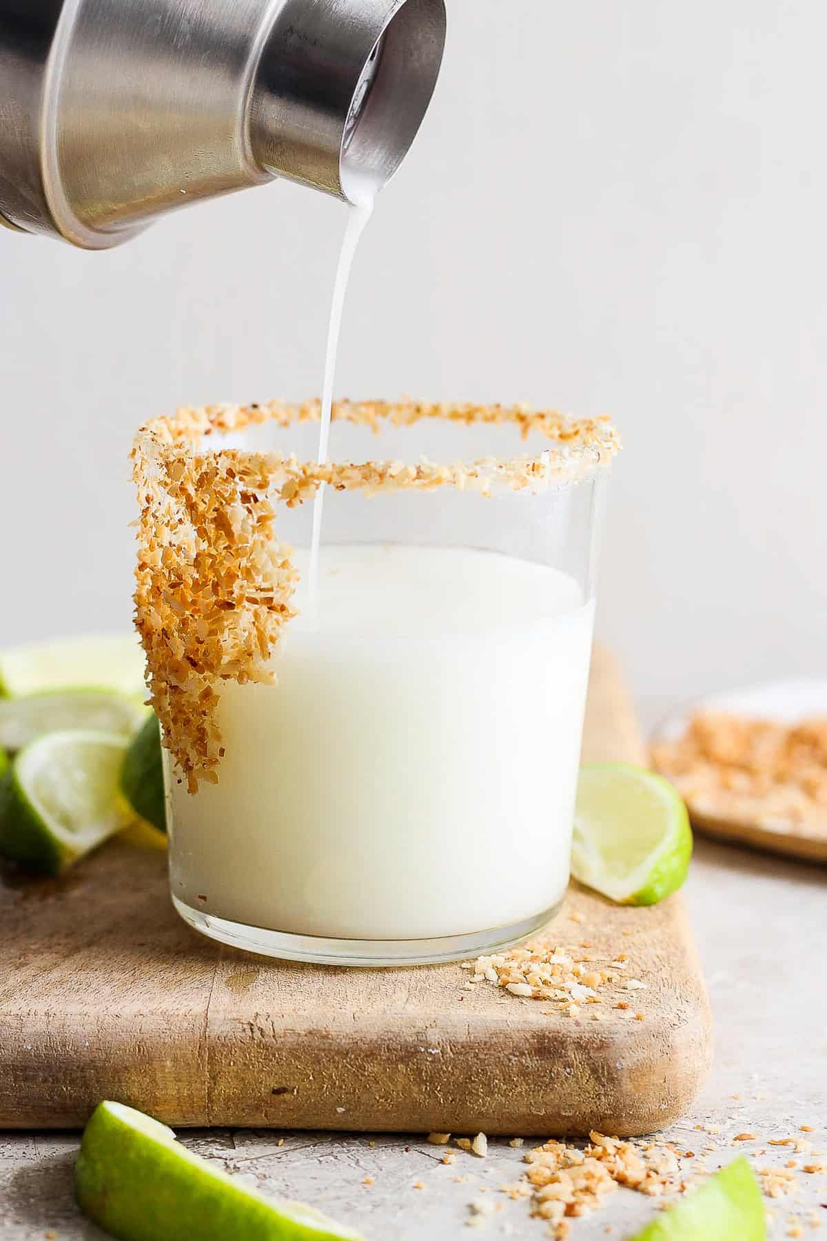 Pouring the margarita into a prepared glass