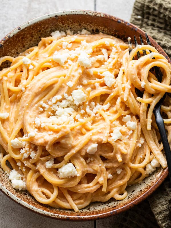 Espagueti Rojo in a bowl garnished with crumbled cotija cheese.